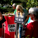 (Image: Death penalty opponents gather near the governor’s mansion Thursday, August 25, 2022, to protest the execution of James Coddington | DOUG HOKE/THE OKLAHOMAN)